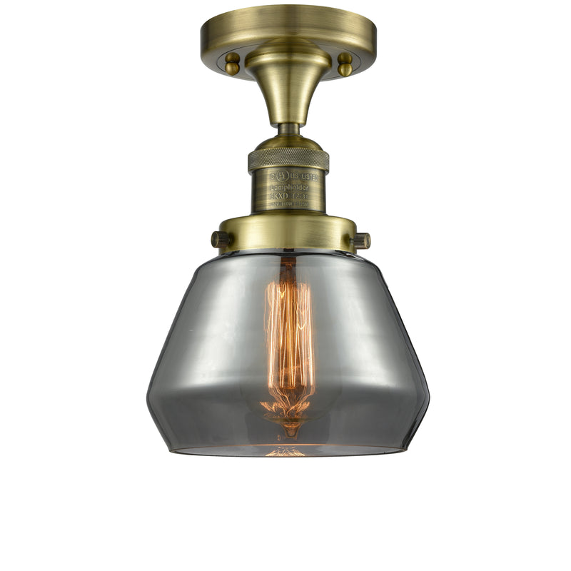 Fulton Semi-Flush Mount shown in the Antique Brass finish with a Plated Smoke shade