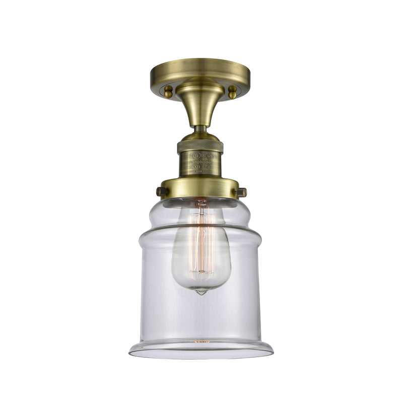 Canton Semi-Flush Mount shown in the Antique Brass finish with a Clear shade