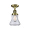 Bellmont Semi-Flush Mount shown in the Antique Brass finish with a Clear shade