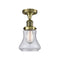 Bellmont Semi-Flush Mount shown in the Antique Brass finish with a Seedy shade