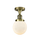 Beacon Semi-Flush Mount shown in the Antique Brass finish with a Matte White shade