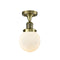 Beacon Semi-Flush Mount shown in the Antique Brass finish with a Matte White shade