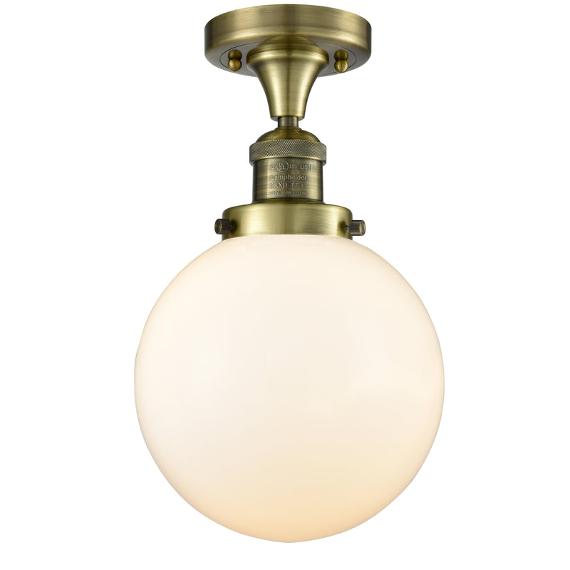 Beacon Semi-Flush Mount shown in the Antique Brass finish with a Matte White shade