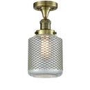 Stanton Semi-Flush Mount shown in the Antique Brass finish with a Clear Wire Mesh shade