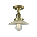 Halophane Semi-Flush Mount shown in the Antique Brass finish with a Clear Halophane shade