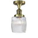 Colton Semi-Flush Mount shown in the Antique Brass finish with a Clear Halophane shade