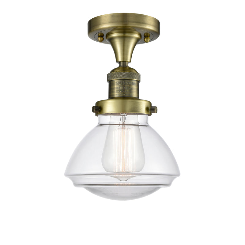 Olean Semi-Flush Mount shown in the Antique Brass finish with a Clear shade