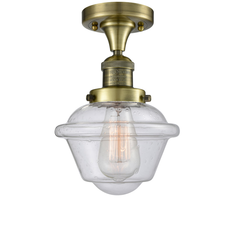 Oxford Semi-Flush Mount shown in the Antique Brass finish with a Seedy shade