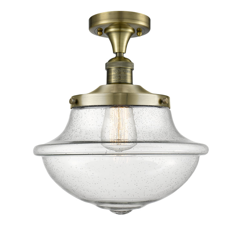 Oxford Semi-Flush Mount shown in the Antique Brass finish with a Seedy shade