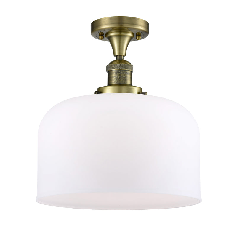 Bell Semi-Flush Mount shown in the Antique Brass finish with a Matte White shade