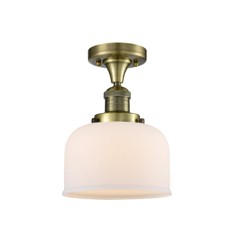 Bell Semi-Flush Mount shown in the Antique Brass finish with a Matte White shade