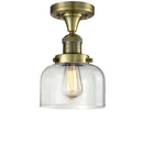 Bell Semi-Flush Mount shown in the Antique Brass finish with a Clear shade