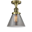 Bell Semi-Flush Mount shown in the Antique Brass finish with a Plated Smoke shade