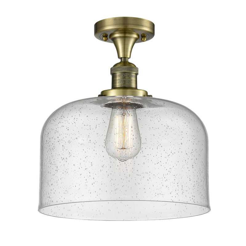 Bell Semi-Flush Mount shown in the Antique Brass finish with a Seedy shade