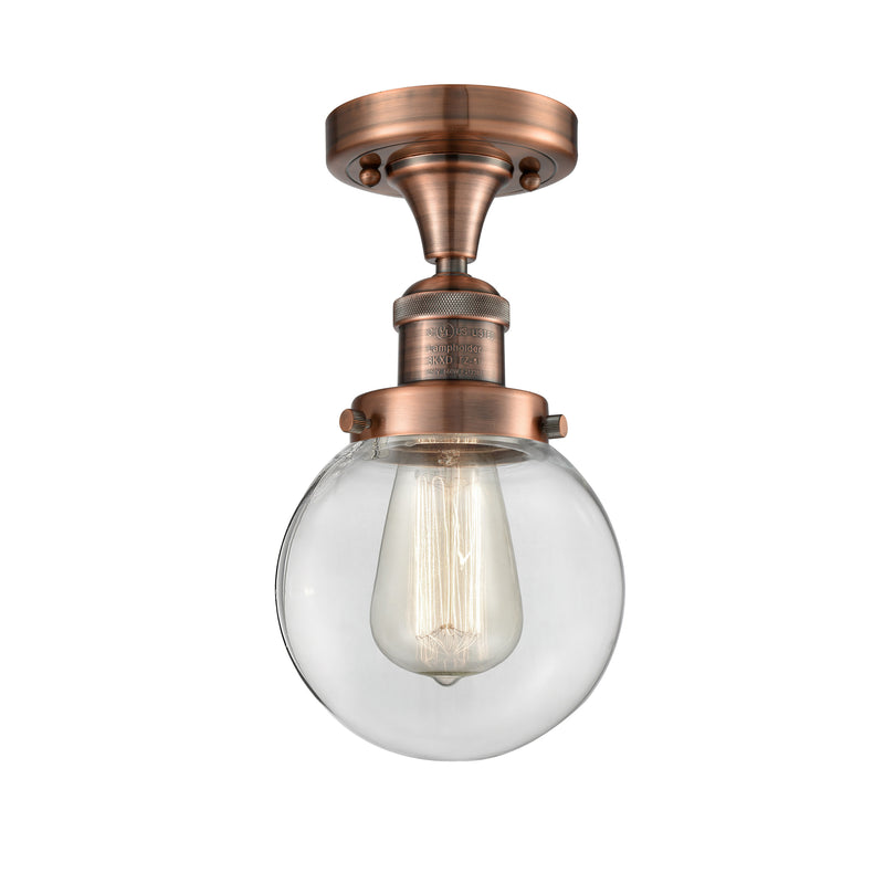 Beacon Semi-Flush Mount shown in the Antique Copper finish with a Clear shade