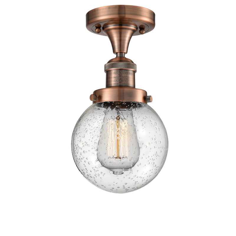 Beacon Semi-Flush Mount shown in the Antique Copper finish with a Seedy shade