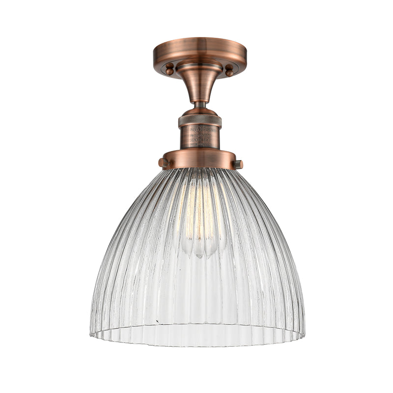 Seneca Falls Semi-Flush Mount shown in the Antique Copper finish with a Clear Halophane shade