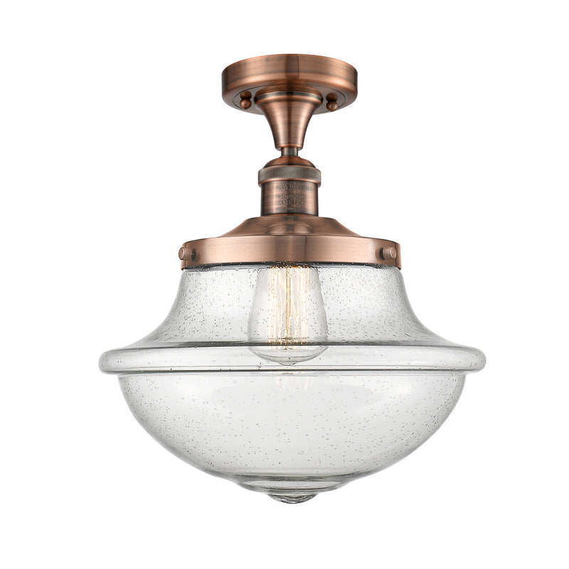 Oxford Semi-Flush Mount shown in the Antique Copper finish with a Seedy shade