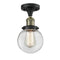 Beacon Semi-Flush Mount shown in the Black Antique Brass finish with a Clear shade