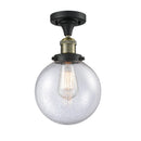 Beacon Semi-Flush Mount shown in the Black Antique Brass finish with a Seedy shade