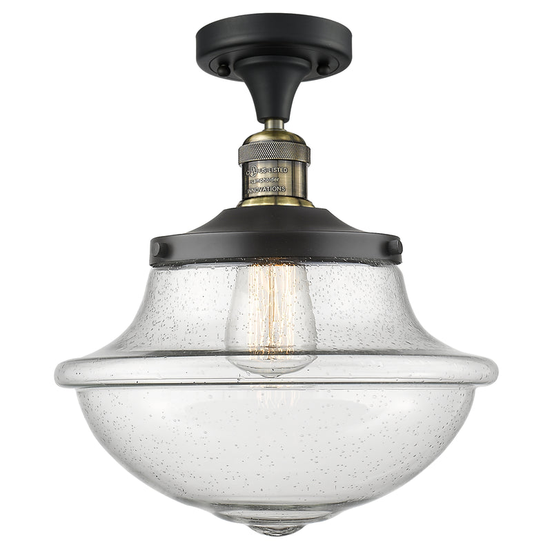 Oxford Semi-Flush Mount shown in the Black Antique Brass finish with a Seedy shade