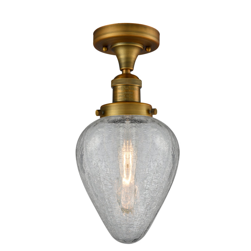 Geneseo Semi-Flush Mount shown in the Brushed Brass finish with a Clear Crackled shade