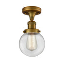 Beacon Semi-Flush Mount shown in the Brushed Brass finish with a Clear shade