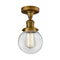 Beacon Semi-Flush Mount shown in the Brushed Brass finish with a Clear shade