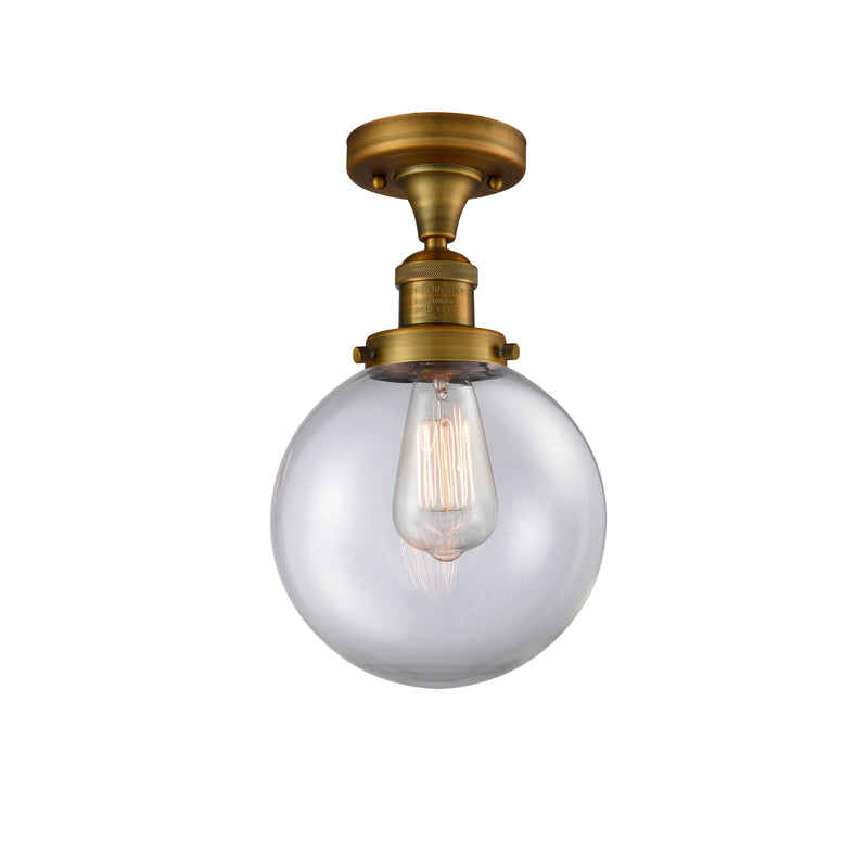 Beacon Semi-Flush Mount shown in the Brushed Brass finish with a Clear shade