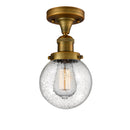 Beacon Semi-Flush Mount shown in the Brushed Brass finish with a Seedy shade