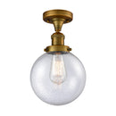 Beacon Semi-Flush Mount shown in the Brushed Brass finish with a Seedy shade