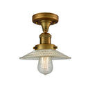 Halophane Semi-Flush Mount shown in the Brushed Brass finish with a Clear Halophane shade