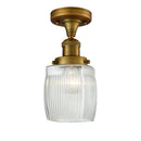 Colton Semi-Flush Mount shown in the Brushed Brass finish with a Clear Halophane shade