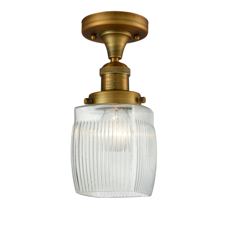 Colton Semi-Flush Mount shown in the Brushed Brass finish with a Clear Halophane shade