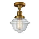 Oxford Semi-Flush Mount shown in the Brushed Brass finish with a Clear shade