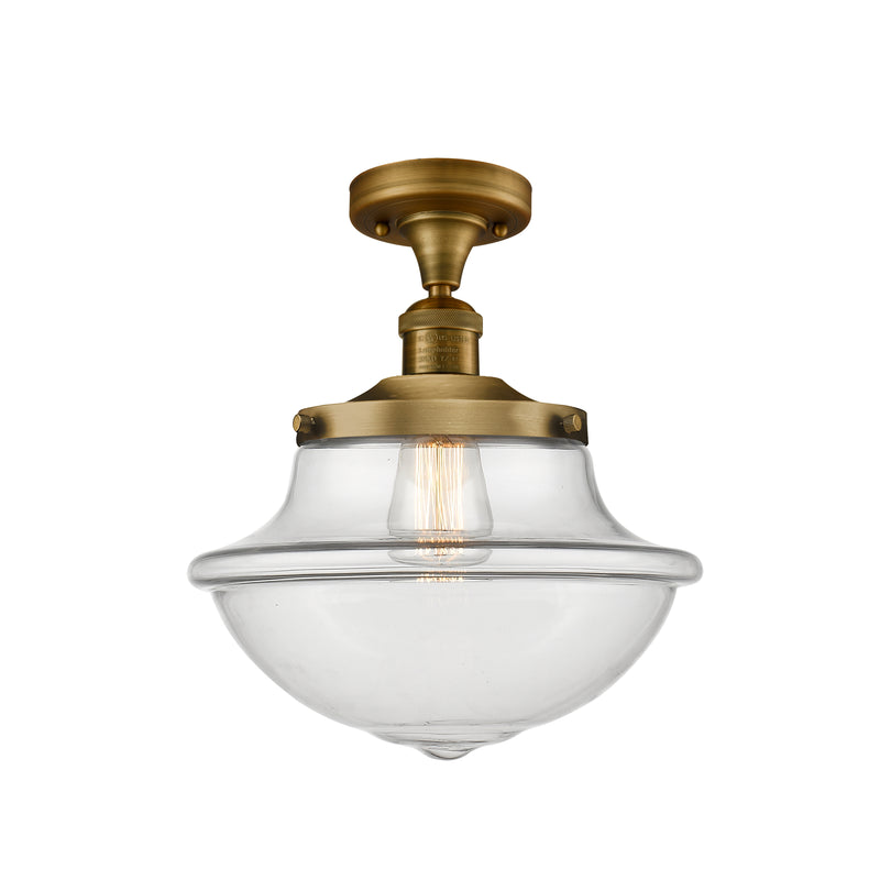 Oxford Semi-Flush Mount shown in the Brushed Brass finish with a Clear shade