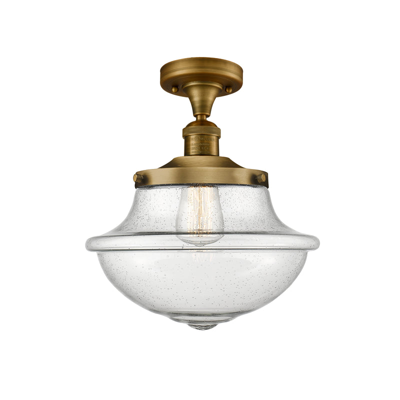 Oxford Semi-Flush Mount shown in the Brushed Brass finish with a Seedy shade