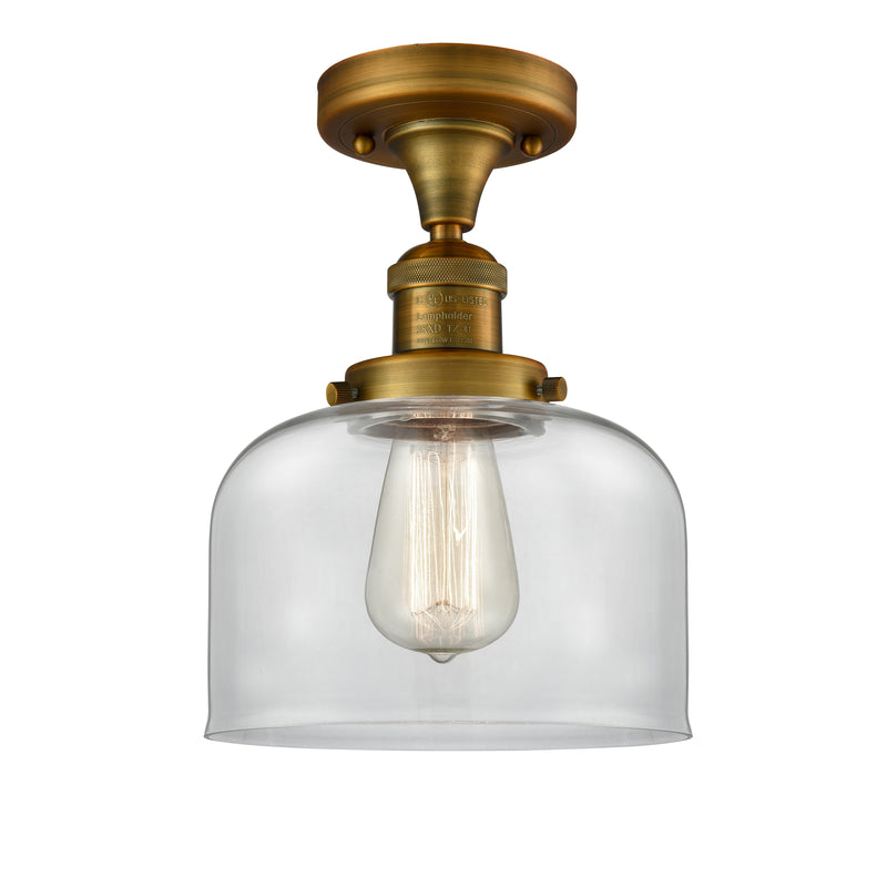 Bell Semi-Flush Mount shown in the Brushed Brass finish with a Clear shade