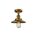 Railroad Semi-Flush Mount shown in the Brushed Brass finish with a Brushed Brass shade