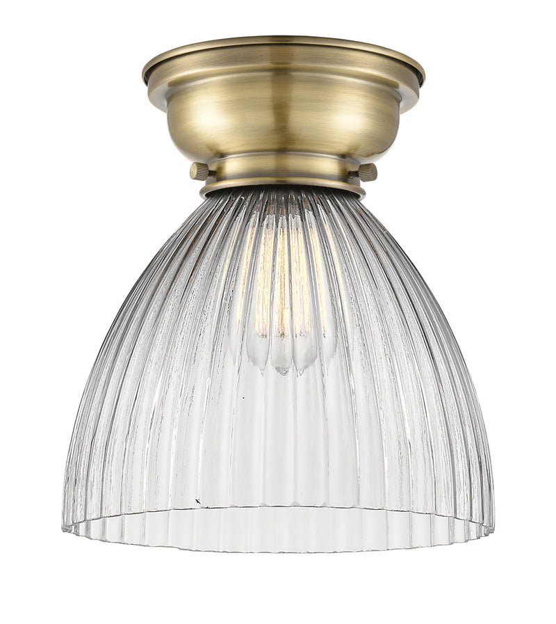 Seneca Falls Flush Mount shown in the Antique Brass finish with a Clear Halophane shade