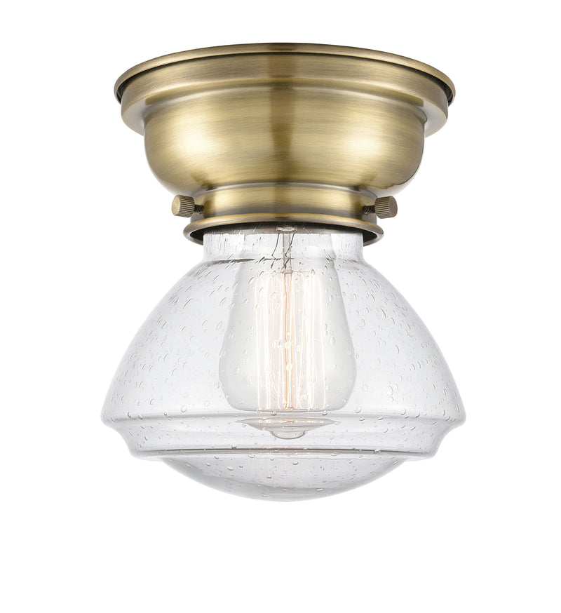 Olean Flush Mount shown in the Antique Brass finish with a Seedy shade