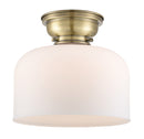 Bell Flush Mount shown in the Antique Brass finish with a Matte White shade