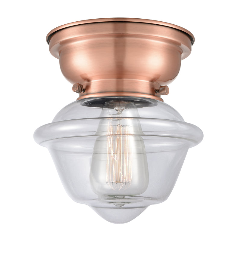 Oxford Flush Mount shown in the Antique Copper finish with a Clear shade