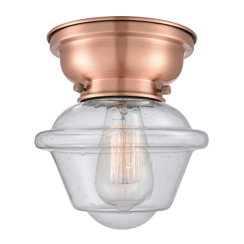 Oxford Flush Mount shown in the Antique Copper finish with a Seedy shade