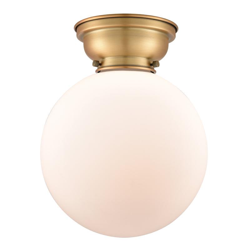 Beacon Flush Mount shown in the Brushed Brass finish with a Matte White shade