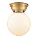 Beacon Flush Mount shown in the Brushed Brass finish with a Matte White shade