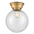 Beacon Flush Mount shown in the Brushed Brass finish with a Seedy shade