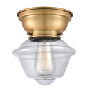 Oxford Flush Mount shown in the Brushed Brass finish with a Clear shade