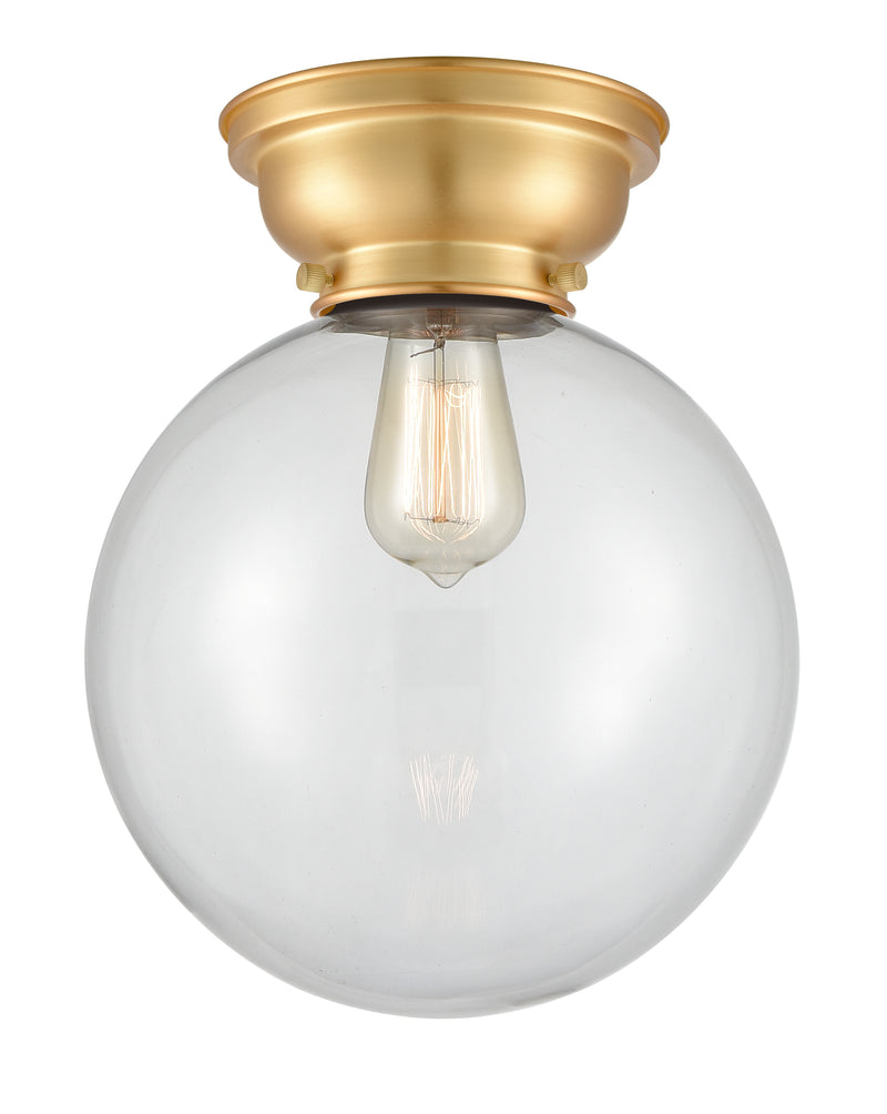 Beacon Flush Mount shown in the Satin Gold finish with a Clear shade