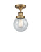 Beacon Semi-Flush Mount shown in the Brushed Brass finish with a Seedy shade